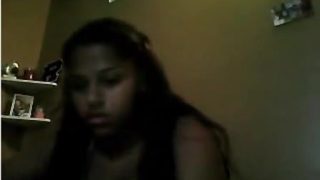 Teen black girl plays with her daddy on webcam