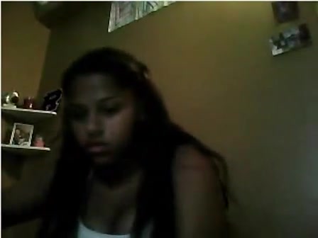 Teen black girl plays with her daddy on webcam